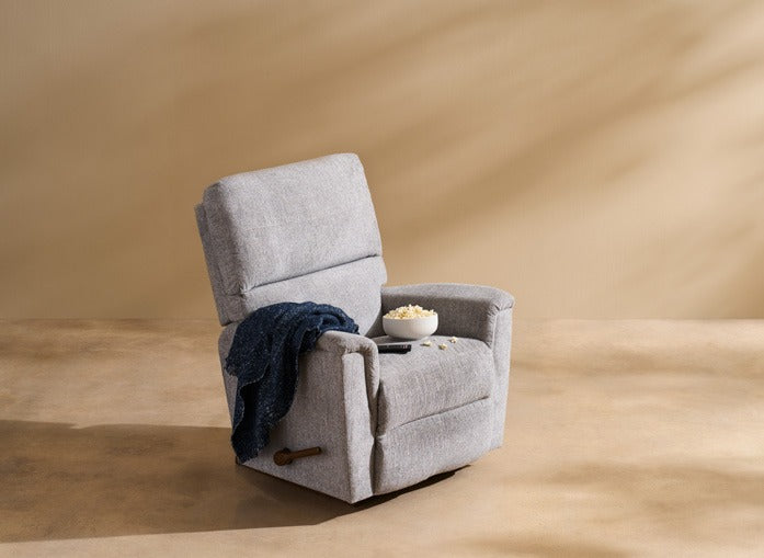 A cozy recliner with a blanket and mug in warm afternoon light