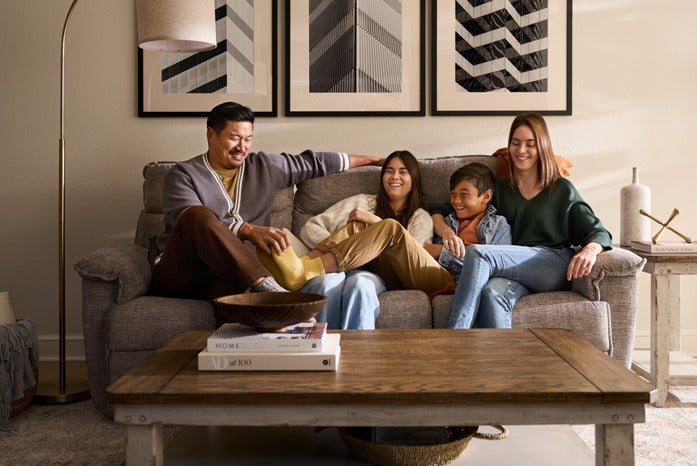 A family sharing a relaxed moment together on their sofa