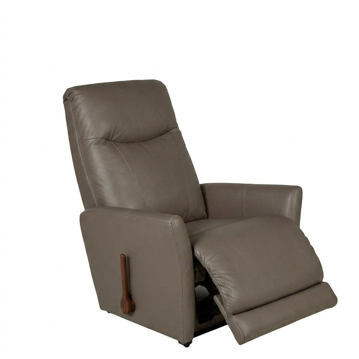 Pebble leather rocker recliner with tufted back and built-in footrest
