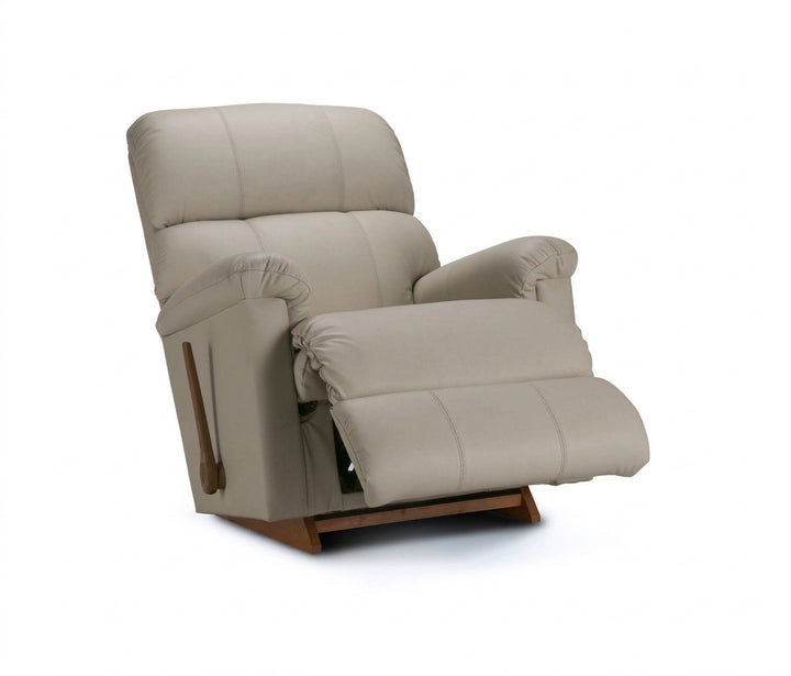 Stone light beige full leather rocker recliner with padded headrest and reclined seat