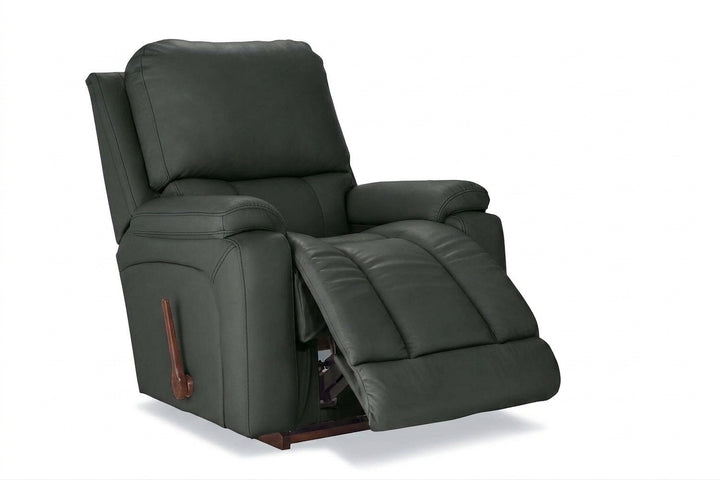 Dark charcoal leather rocker recliner with padded arms and reclining footrest