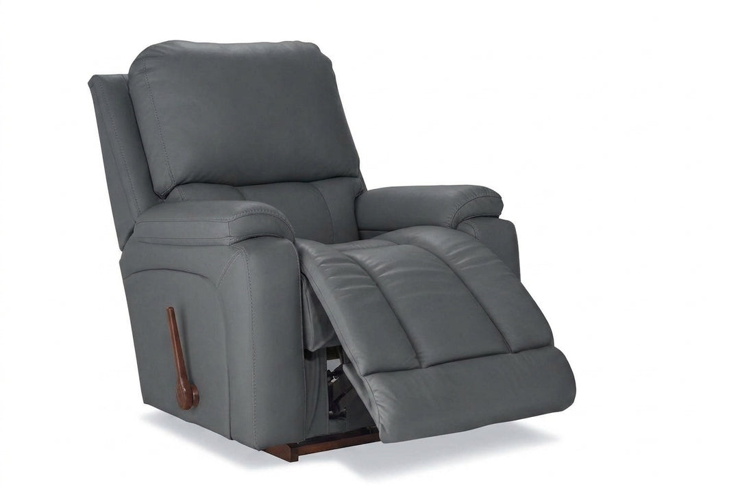 Dark gray leather rocker recliner with padded arms and hinged reclining footrest