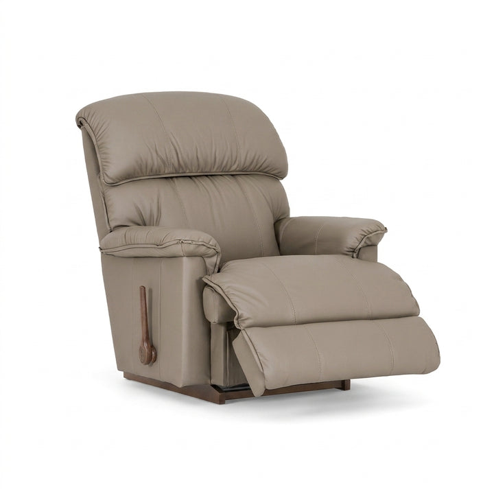 Mocca leather rocker recliner with padded arms and recline footrest, side handle.