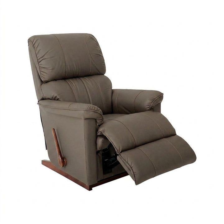 Taupe leather rocker recliner with padded armrests and extended footrest.