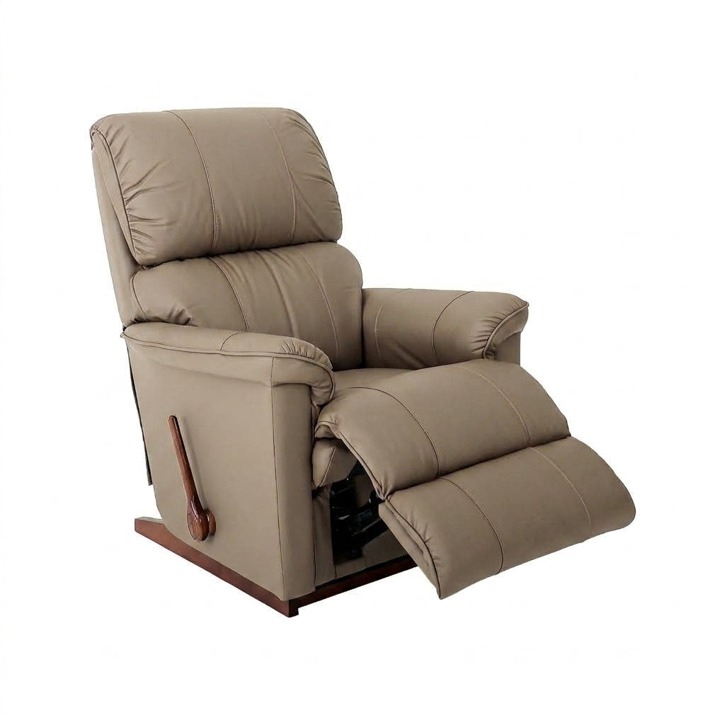 Mushroom leather rocker recliner with padded armrests and extended footrest.