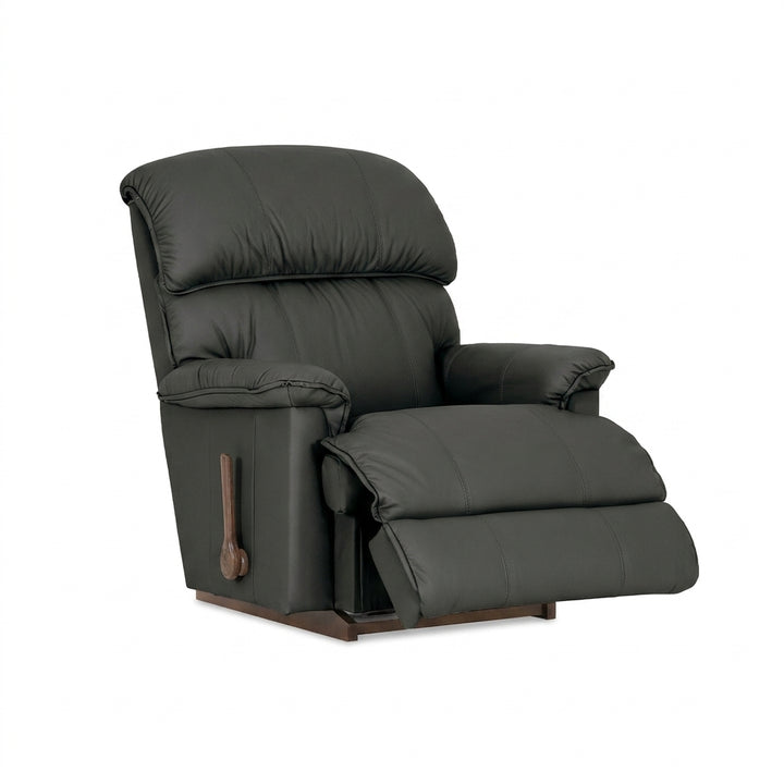 Black leather rocker recliner with padded arms and recline footrest, side handle.