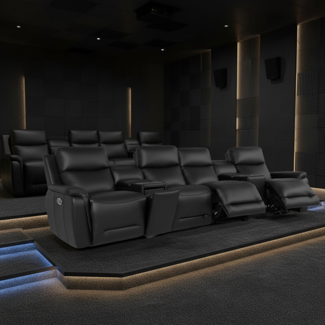 Dark movie theater with recliner seats in a dimly lit room