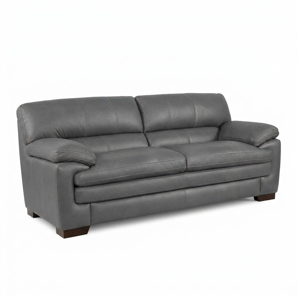 Light grey sofa with rolled arms, cushioned back, and dark wooden legs