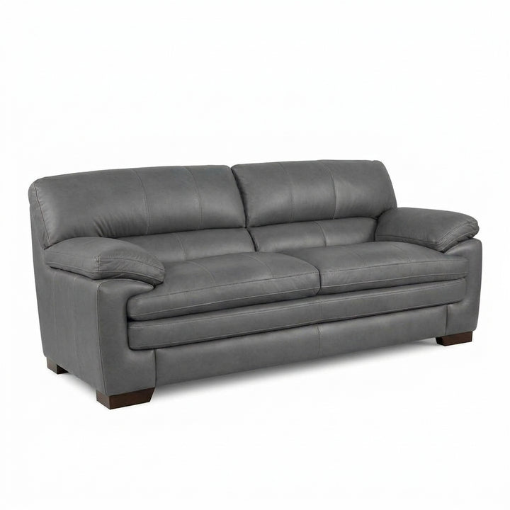 Light grey sofa with rolled arms, cushioned back, and dark wooden legs