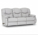 Reclining leather sofa in light gray with tufted back and padded armrests