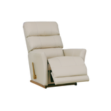 Cream leather-look rocker recliner with padded arms and recline footrest, angled view