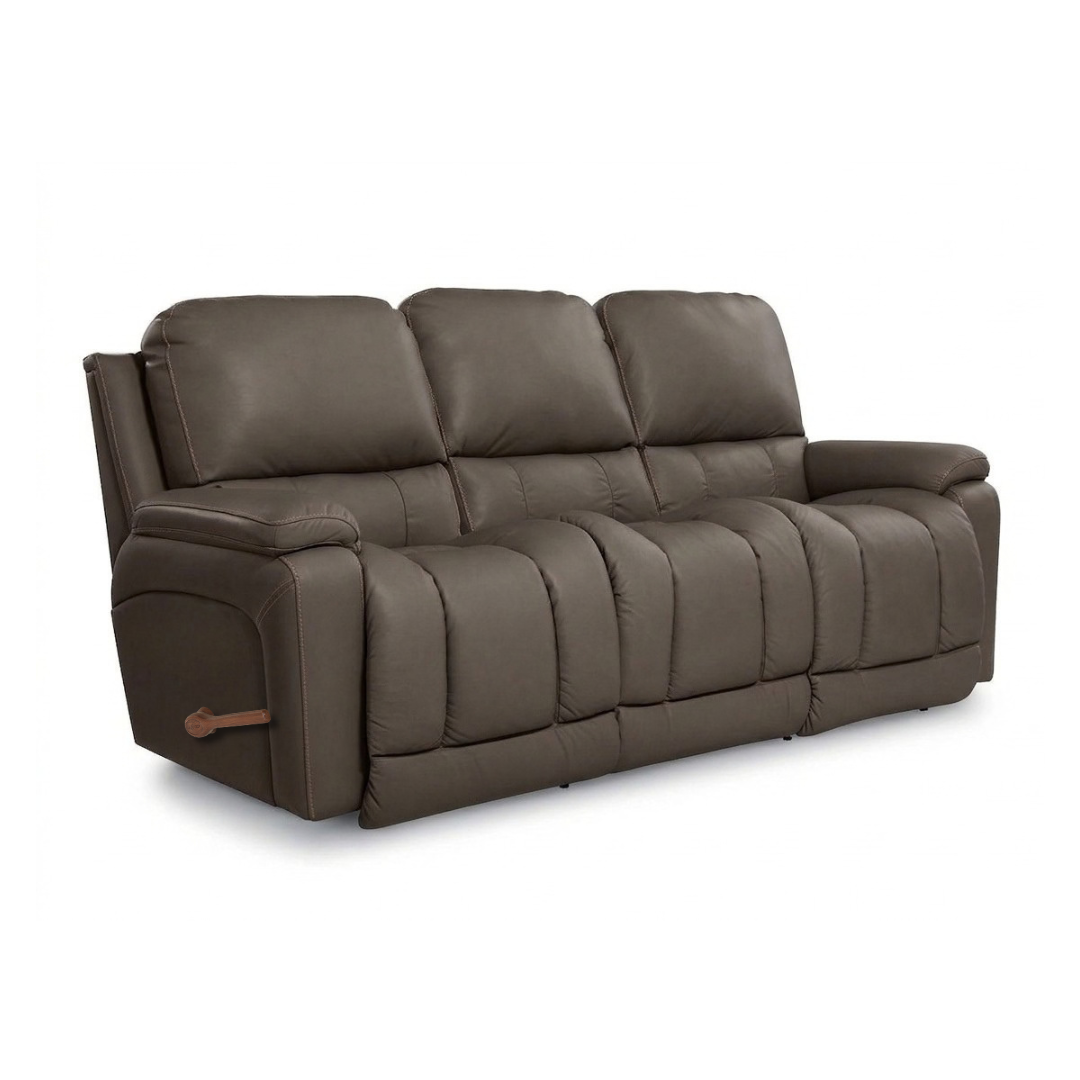 Leather motion reclining sofa in brown, padded arms, recline panels, wood pull tab.