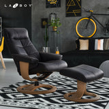 Black leather recliner chair with matching ottoman and wooden pedestal base