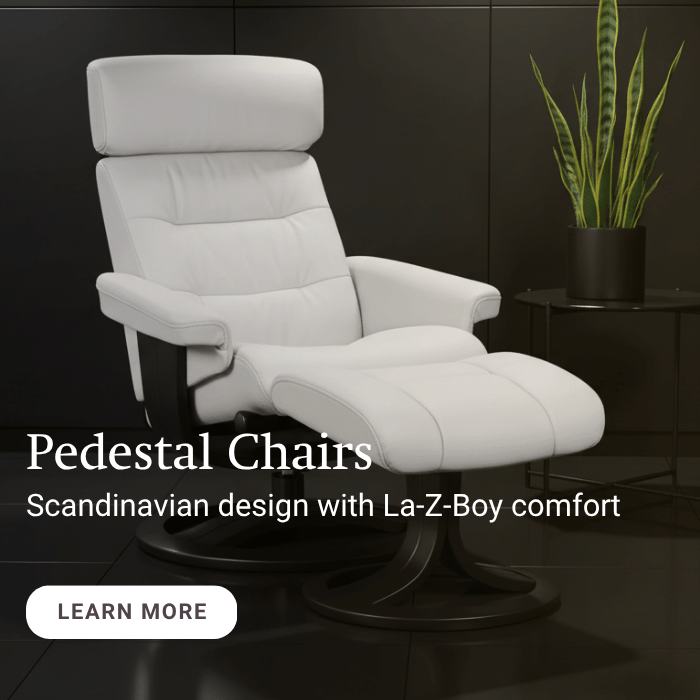 White pedestal chair with La-Z-Boy comfort in a dark room setting
