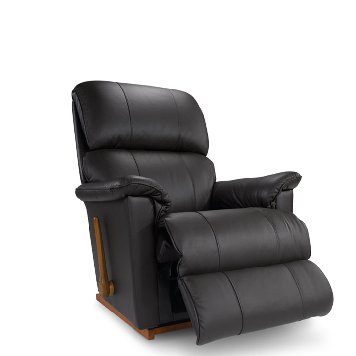 Black leather rocker recliner with padded armrests and extended footrest.