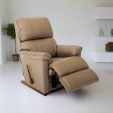 STANLEY leather rocker recliner in tan with recline footrest and dark wood base