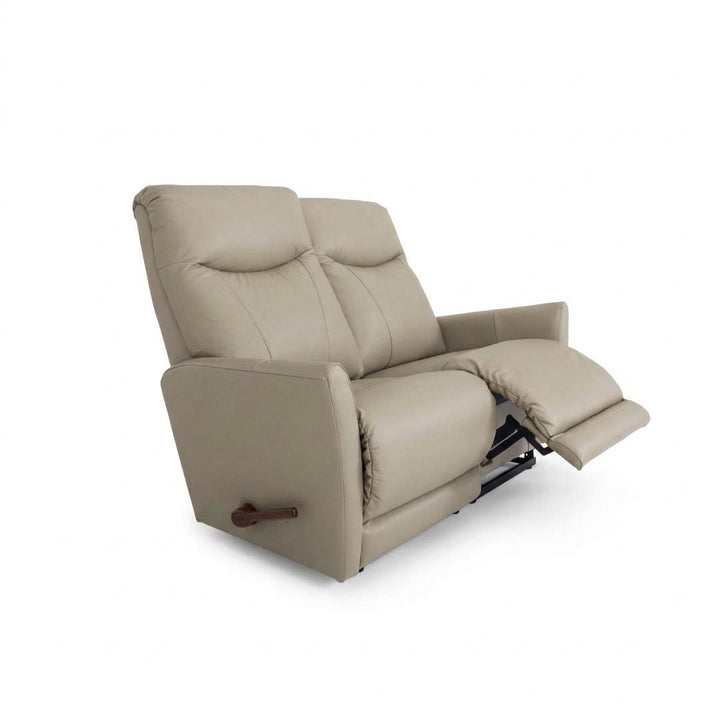 Light beige leather reclining loveseat with wide armrests, padded seats, and pull-tab recline lever