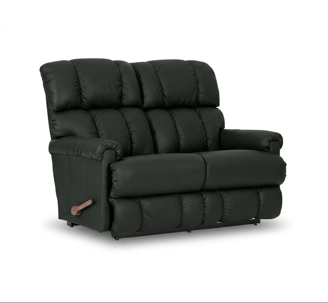 Black full-leather reclining loveseat with padded armrest and tufted back cushions