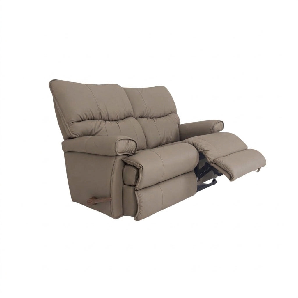 Taupe leather motion reclining loveseat with padded arms and extended footrest