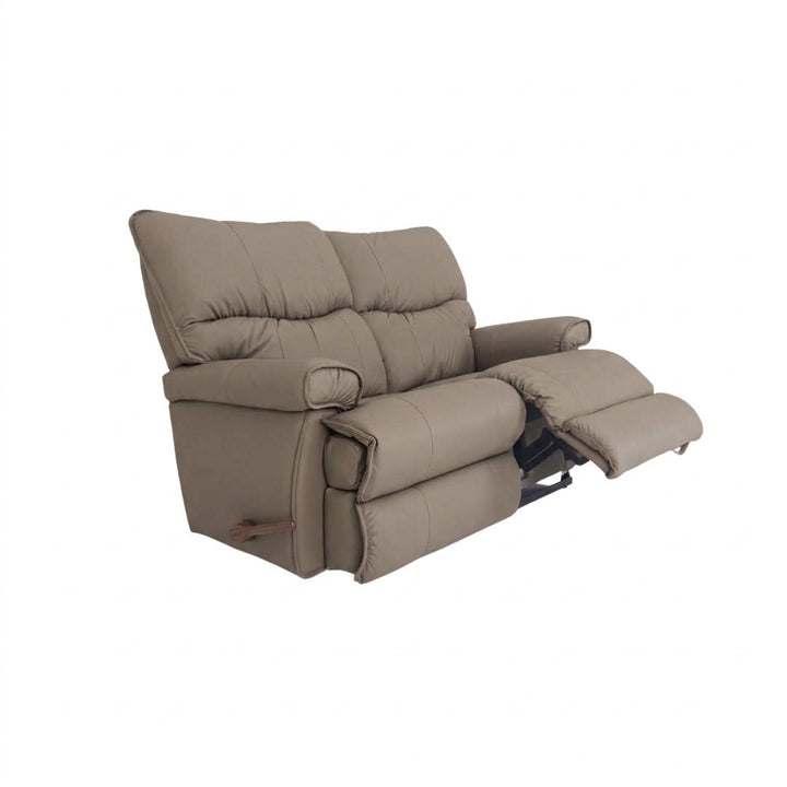 Taupe leather motion reclining loveseat with padded arms and extended footrest
