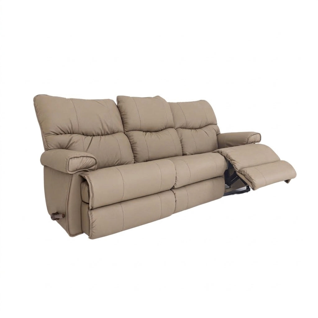 Leather motion reclining sofa in light tan leather, tufted back and reclining footrests