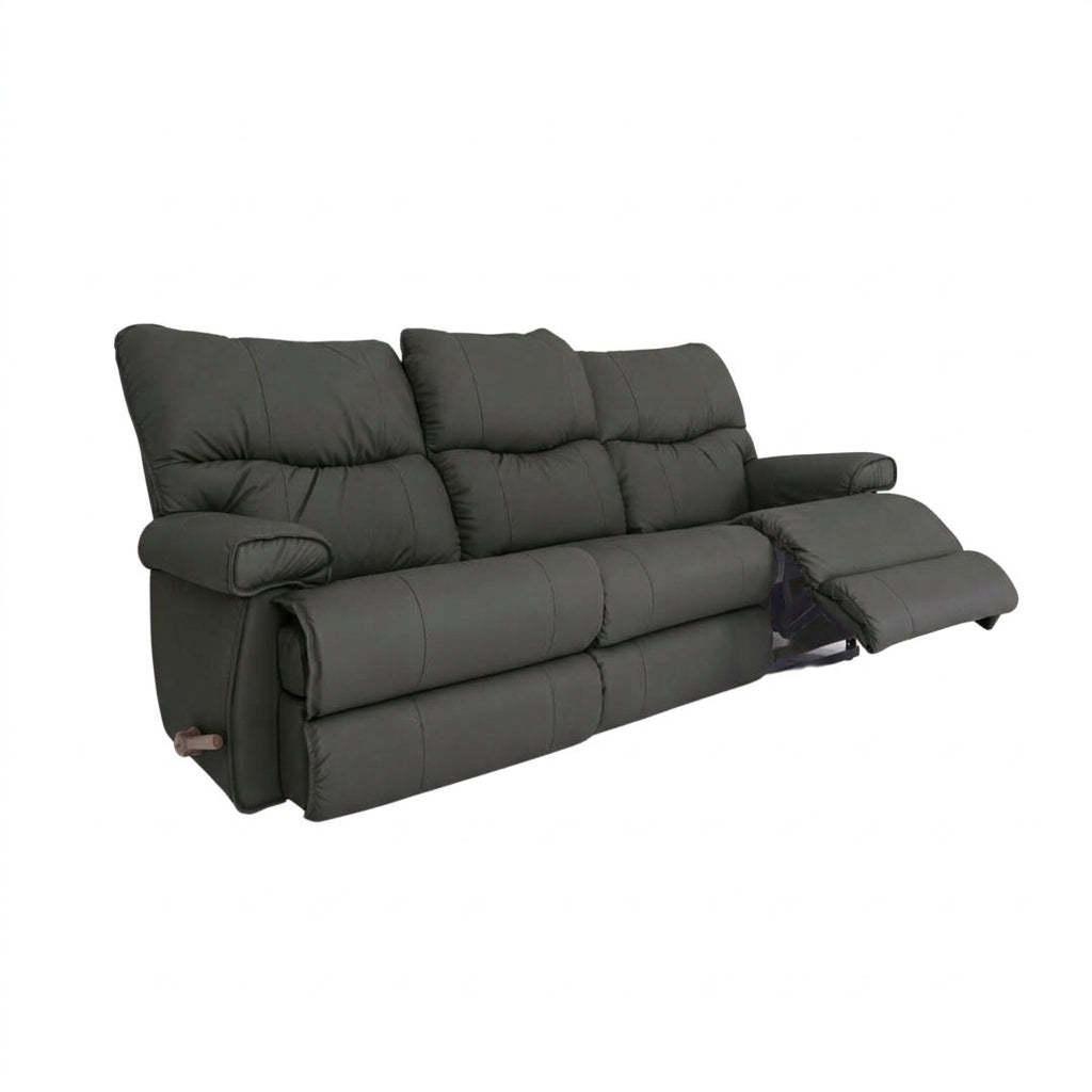 Leather motion reclining sofa in dark gray leather, padded arms and reclining footrests