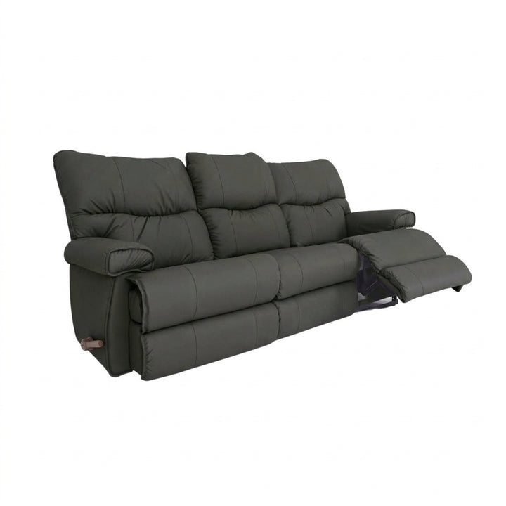 Leather motion reclining sofa in dark gray leather, padded arms and reclining footrests