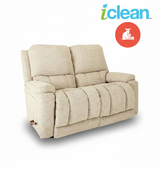 Fabric reclining loveseat with two seat cushions and rolled back in light beige