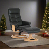 Black leather recliner lounge chair with padded headrest, arms, and ottoman