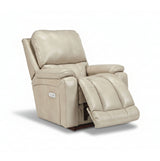 Full leather power rocker recliner in light beige, reclined with extended footrest