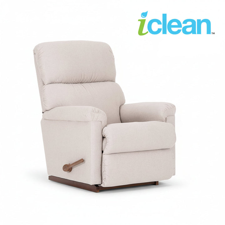 Fabric rocker recliner in light beige with padded arms, back, and wooden recline handle