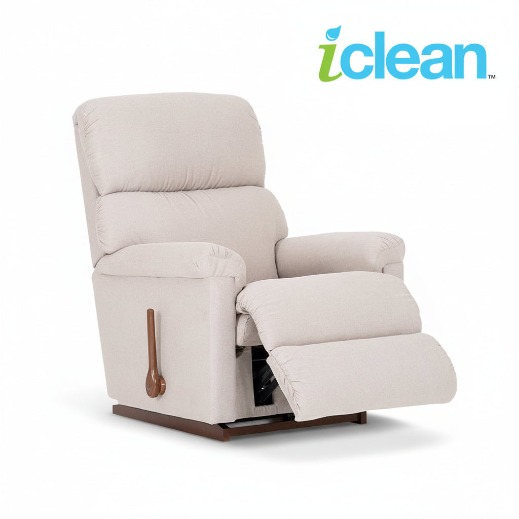 Light beige fabric rocker recliner with extended footrest, padded arms, and wooden handle