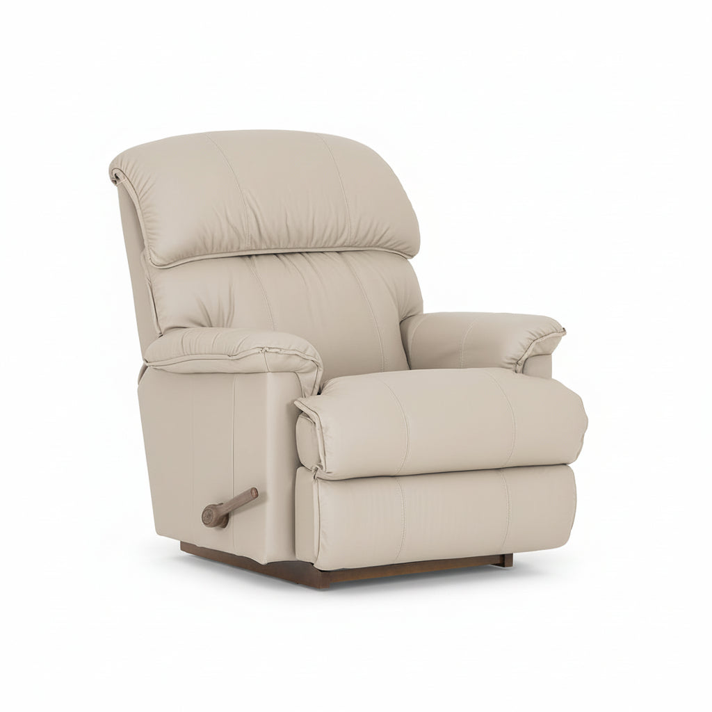 Beige full leather rocker recliner with padded armrests and footrest, side view